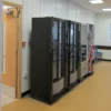 Aluminium checker plate positioned beneath vending machines to protect the floor surface from damage and heavy foot traffic.