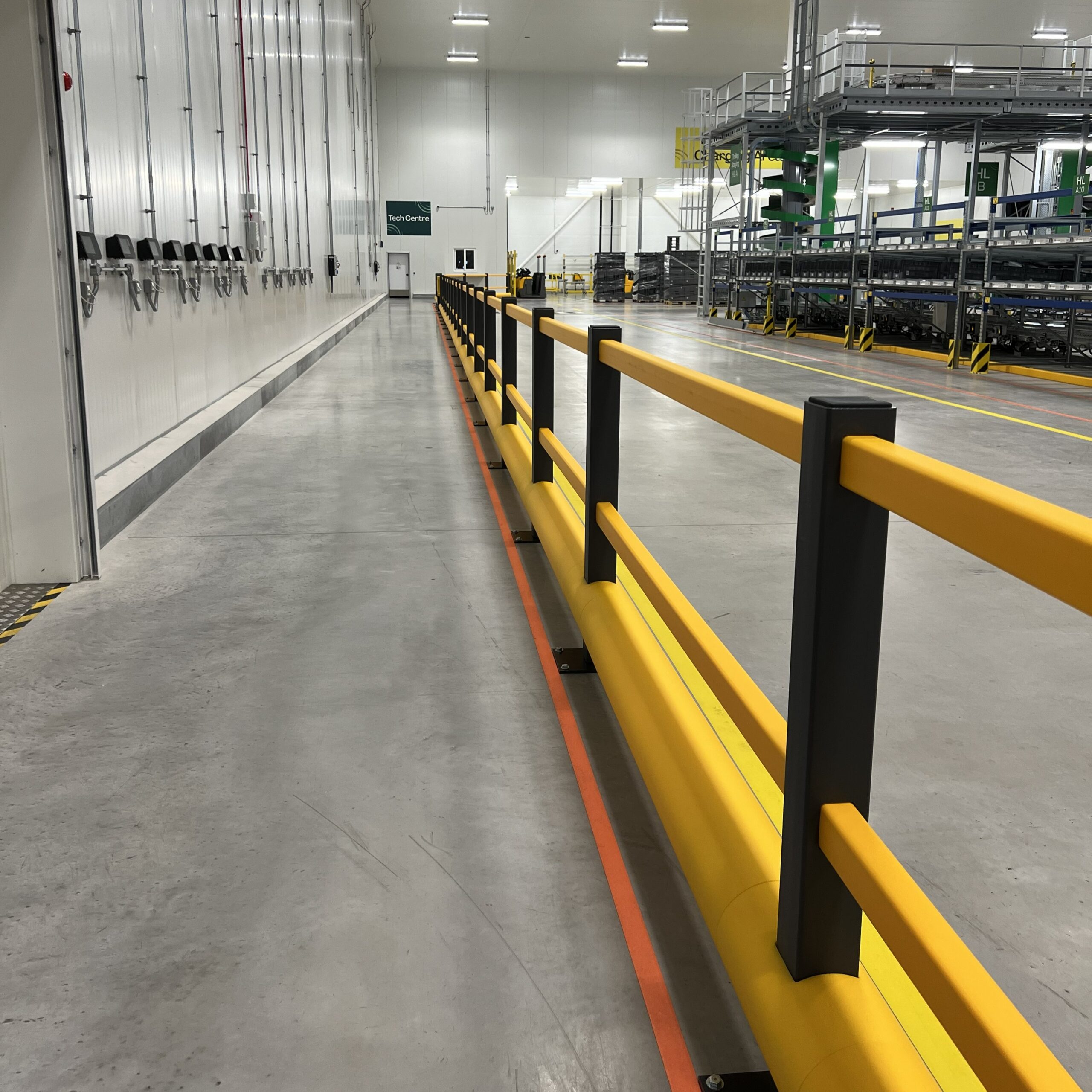 Brandsafe pedestrian safety barrier installed along a chilled food manufacturing walkway