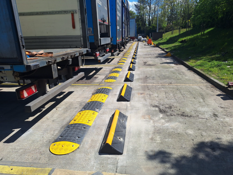 Brandsafe speed bumps and wheel stops installed at an Amazon site to manage HGV movements and improve traffic safety.