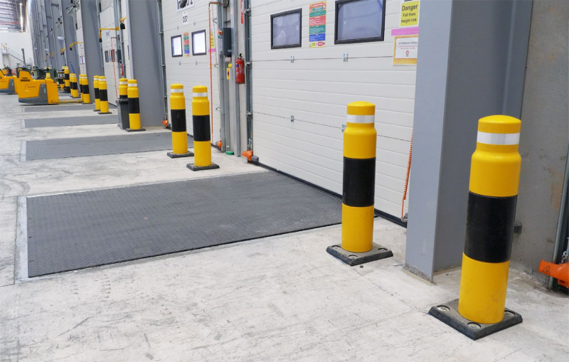 ImpactSAFE Heavy Duty Bollard installed to protect a building from vehicle strikes, featured in the Brandsafe building protection category.